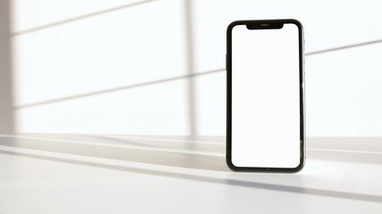 A photo of a black smartphone on a white background