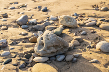 Rocks with holes on the beach
