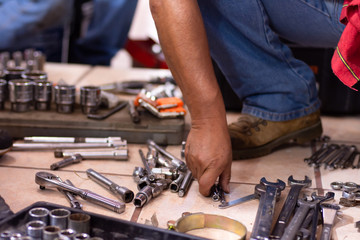 Unrecognizable person works with tools in a workshop