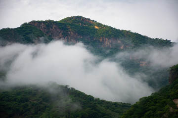 Fototapeta na wymiar cloudy green mountain landscape