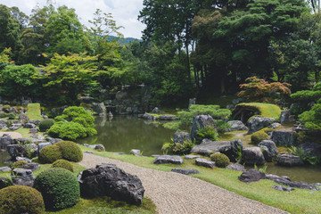 japanese garden with stone and pond
