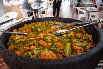 Traditional Mexican chili peppers in molcajete