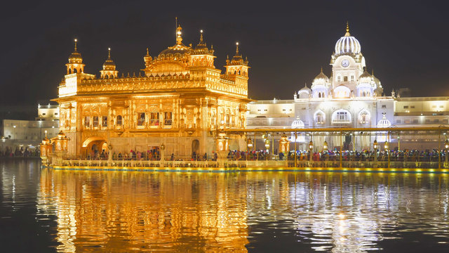 close view of the beautiful sikh golden temple at night in india