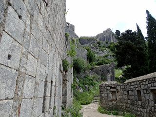 Ruined Fortifications of Kotor in Kotor, Montenegro. Fortifications of Kotor are an integrated...