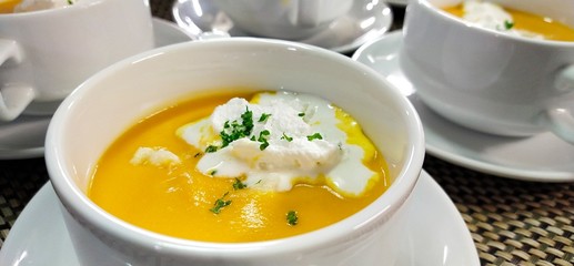 pumpkin soup in white bowl