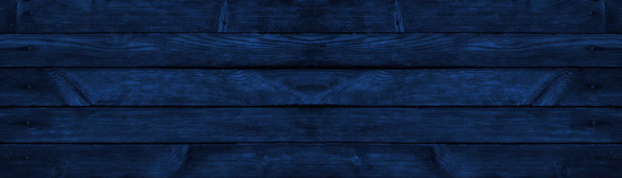 Blue grunge background. Wood texture background. Old painted wood wall. Dark blue background with copy space.
