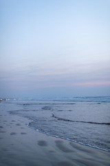 Naklejka na ściany i meble On the beach during blue hour sunset 