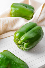 Green bell pepper on table