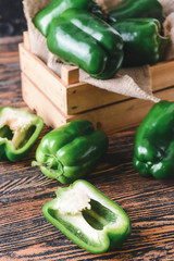 Green bell pepper in box on table