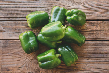 Green bell pepper on wooden table