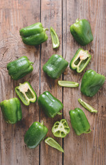 Green bell pepper on wooden background