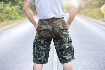 Asia man in bermuda shorts and t-shirt, outdoor activity concept