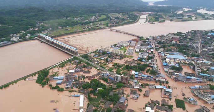 Aerial view of small town been Flooded countryside neighbourhood in Sichuan China at 2020 Homes, houses overflowing muddy water concept of nature disaster climate change 4k footage
