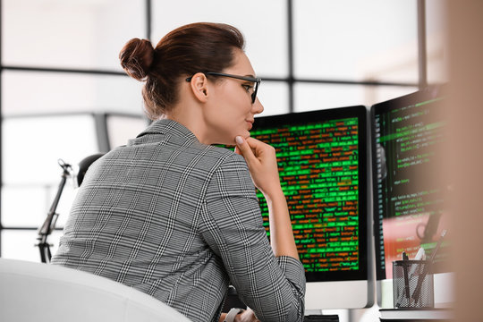 Female programmer working in office