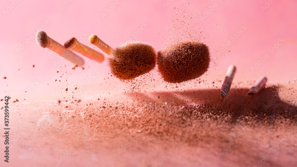 Wall mural Make up brushes with powder splashes isolated on pink background