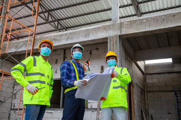 Asian engineer technician team introduction and supervise of workers to build a house in the construction site