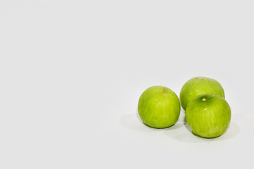 Closeup of Fresh a Pile of green jujube isolated on white background, Selective Focus.