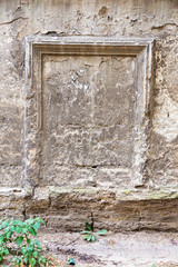 Concrete wall with cracks, scratches and the remnants of the old paint as a background for any creative art project. Great backgrounds and textures.