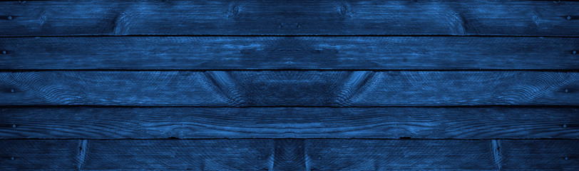 Blue grunge background. Wood texture background. Old painted wood wall. Dark blue background with...