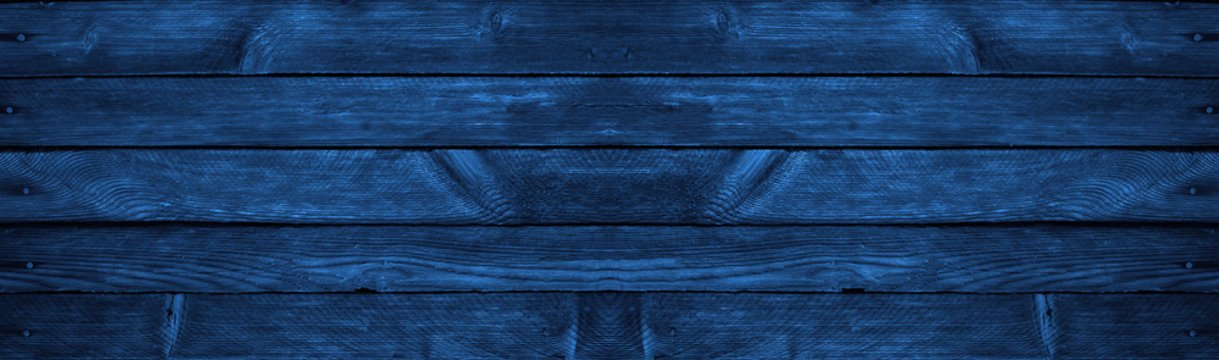 Blue grunge background. Wood texture background. Old painted wood wall. Dark blue background with copy space.