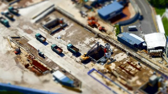 [4K Time lapse] Miniature image of Power shovel digging a hole at construction site