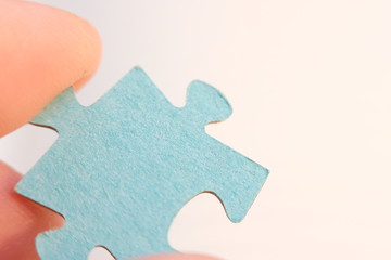 hand holding puzzle