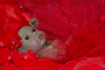 Reborn doll portait in red dress