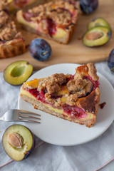 sweet home made plum crumble pie on a table