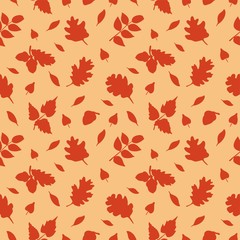 Seamless vector pattern of repeating plant elements on a light brown background with oak and other tree leaves and acorns.
