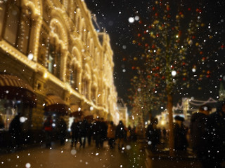 Urban city lights bokeh, Bright Christmas Street Illumination on the facade of the buildings. The...