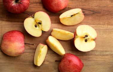 Top view a lot of  fresh Gala red apple isolated on wooden background