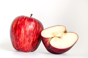 One apple and a half-cut apple near each other, Isolated apples. Red apple fruit with slice (cut) isolated on white background, Red apple fruit isolated on the white background with clipping path.