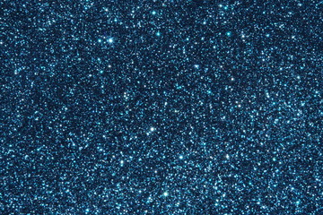 blue Sparkling Lights Festive background with texture. Abstract Christmas twinkled bright bokeh defocused and Falling stars. Winter Card or invitation	