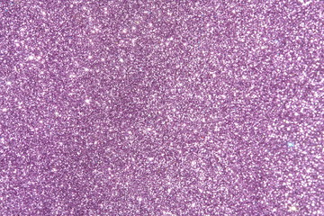 purple Sparkling Lights Festive background with texture. Abstract Christmas twinkled bright bokeh defocused and Falling stars. Winter Card or invitation	