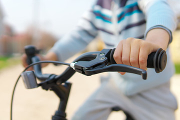 Boy hand on handlebar