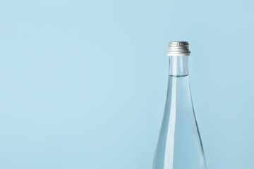 Bottle of clean water on color background