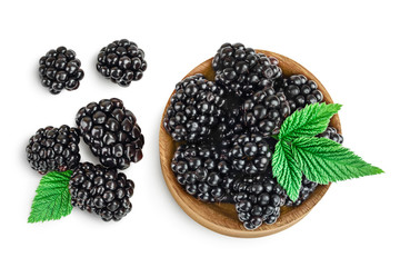 blackberry in wooden bowl isolated on a white background closeup. Clipping path and full depth of field. Top view. Flat lay