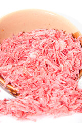 Red dried shrimp Is a food preservation Of Asian people on a white background. Use the flash for sharpness in the studio.