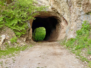 Cave tunnel with a road ear Erma river gorge, Bulgaria