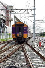 Fototapeta premium Trains running on the train tracks to the station in Thailand. Select focus with shallow depth of field.