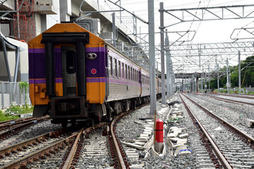 Trains running on the train tracks to the station in Thailand. Select focus with shallow depth of field.