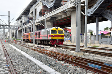 Trains running on the train tracks to the station in Thailand. Select focus with shallow depth of field.