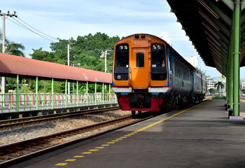 Fototapeta premium Trains running on the train tracks to the station in Thailand. Select focus with shallow depth of field.