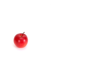 fake red apple on white background