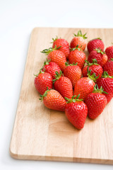 strawberries on cutting board