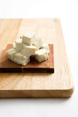tofu cube on cutting board