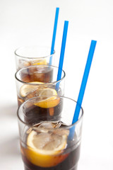 cola with slice of lemon in glass