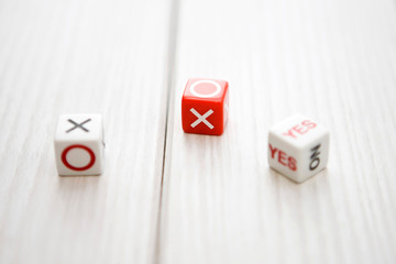 YES' or 'NO' and 'X' or 'O' dice