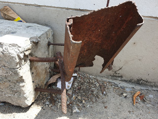 concrete pile smashed pieces of concrete rubble debris on construction site.old rusty wire,Steel...