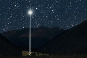 The moon shines over the manger of christmas of Jesus Christ.
